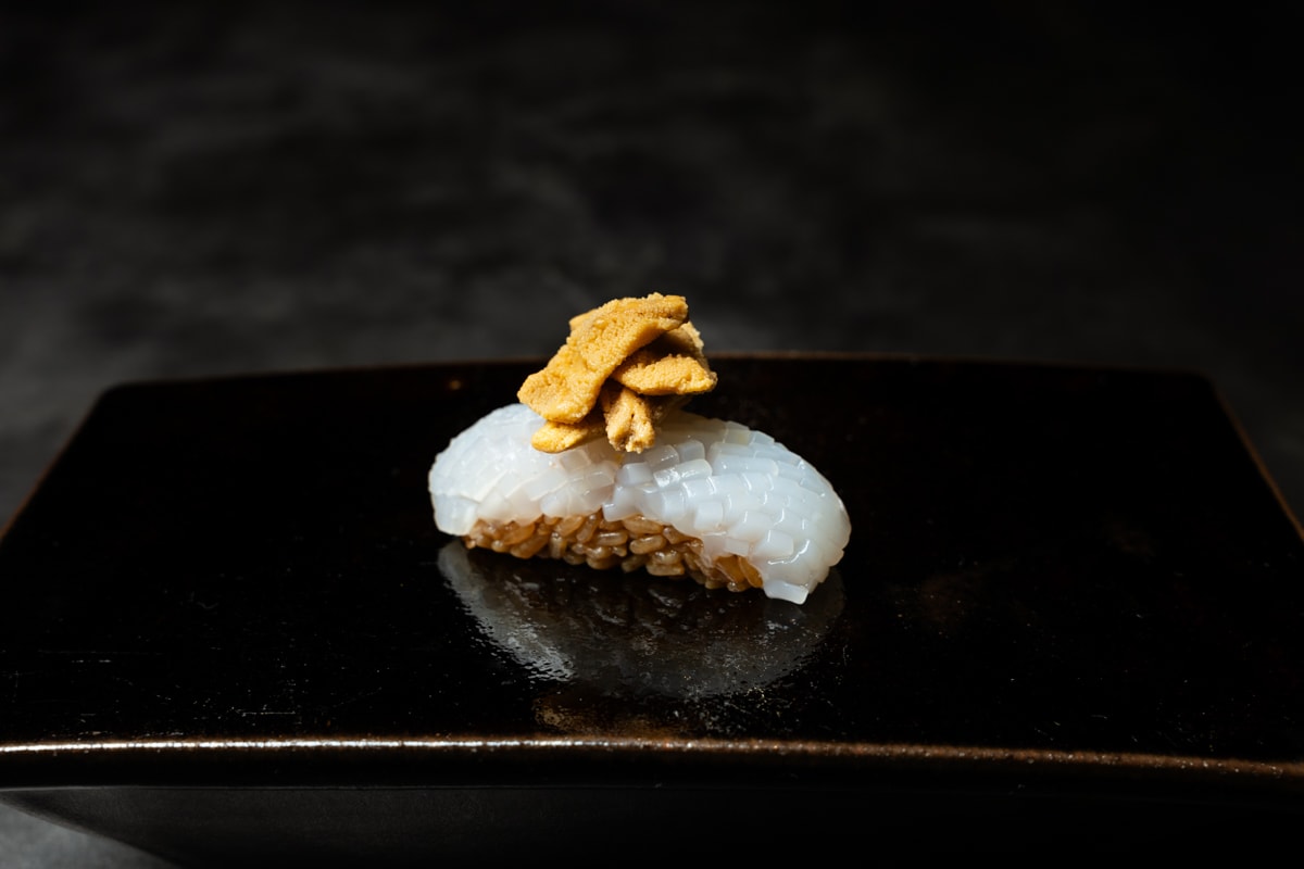 A cocktail with cardamom in a short glass